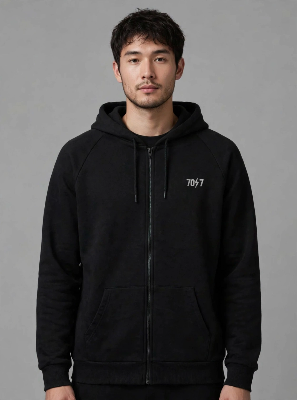 The Collective Black Hoodie — black front view on model | 707 Official zip hoodie