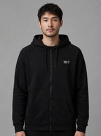 The Collective Black Hoodie — black front view on model | 707 Official zip hoodie