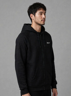 The Collective Black Hoodie — black on model, three-quarter view | 707 Official zip hoodie