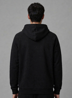 The Collective Black Hoodie — black on model, back view | 707 Official zip hoodie