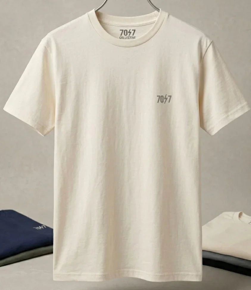 Beige t-shirt with '7047' branding on a gray background