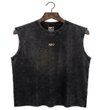 Black sleeveless shirt on a hanger against a white background