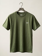 Green t-shirt with a logo on a hanger against a white background