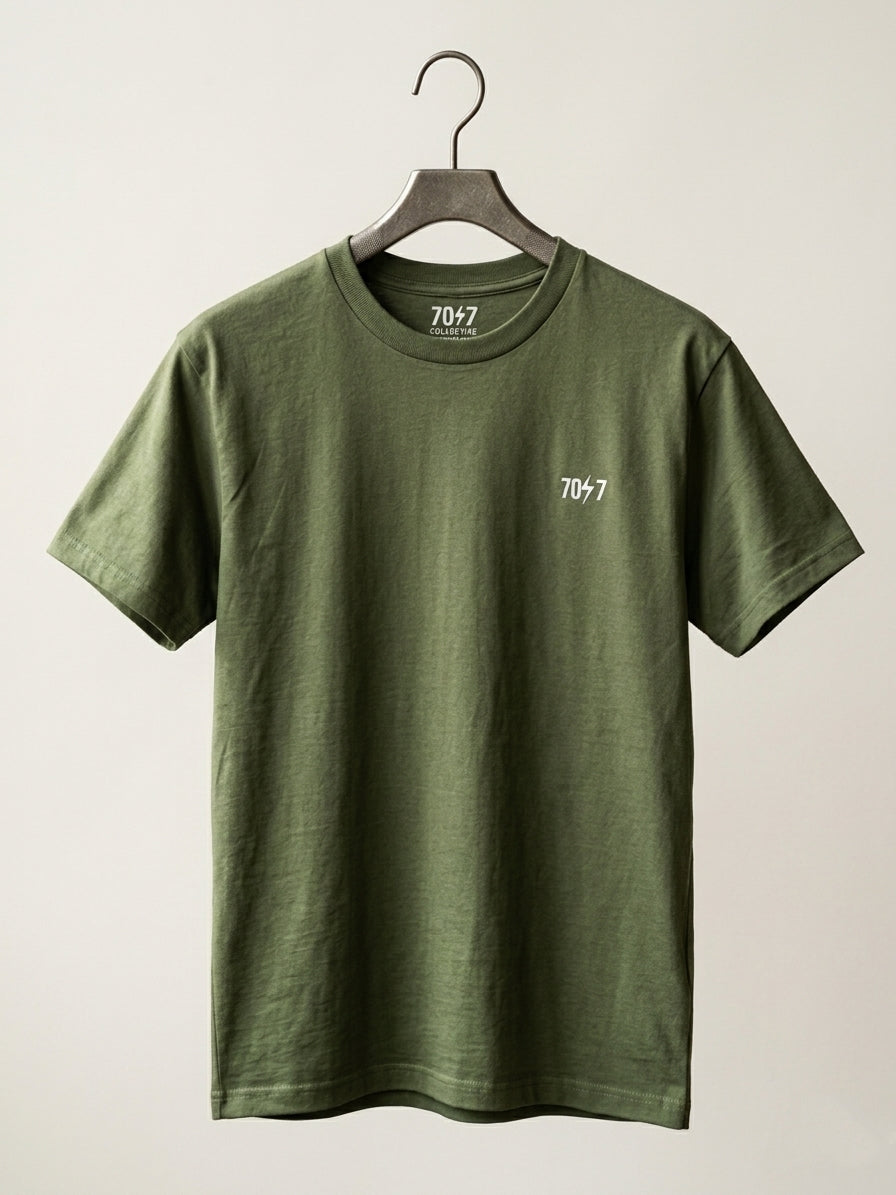 Green t-shirt with a logo on a hanger against a white background