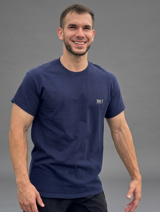 The Collective Core — navy front view on model | 707 Official tee