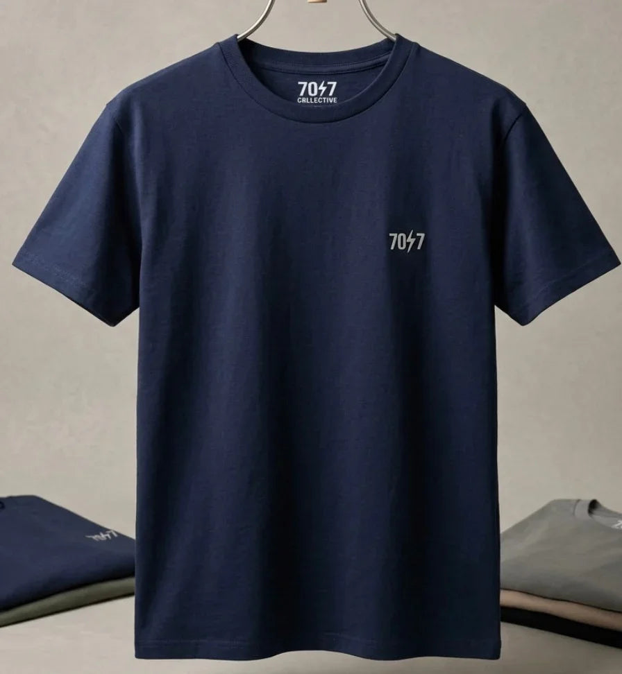 Navy blue t-shirt with a logo on a beige background