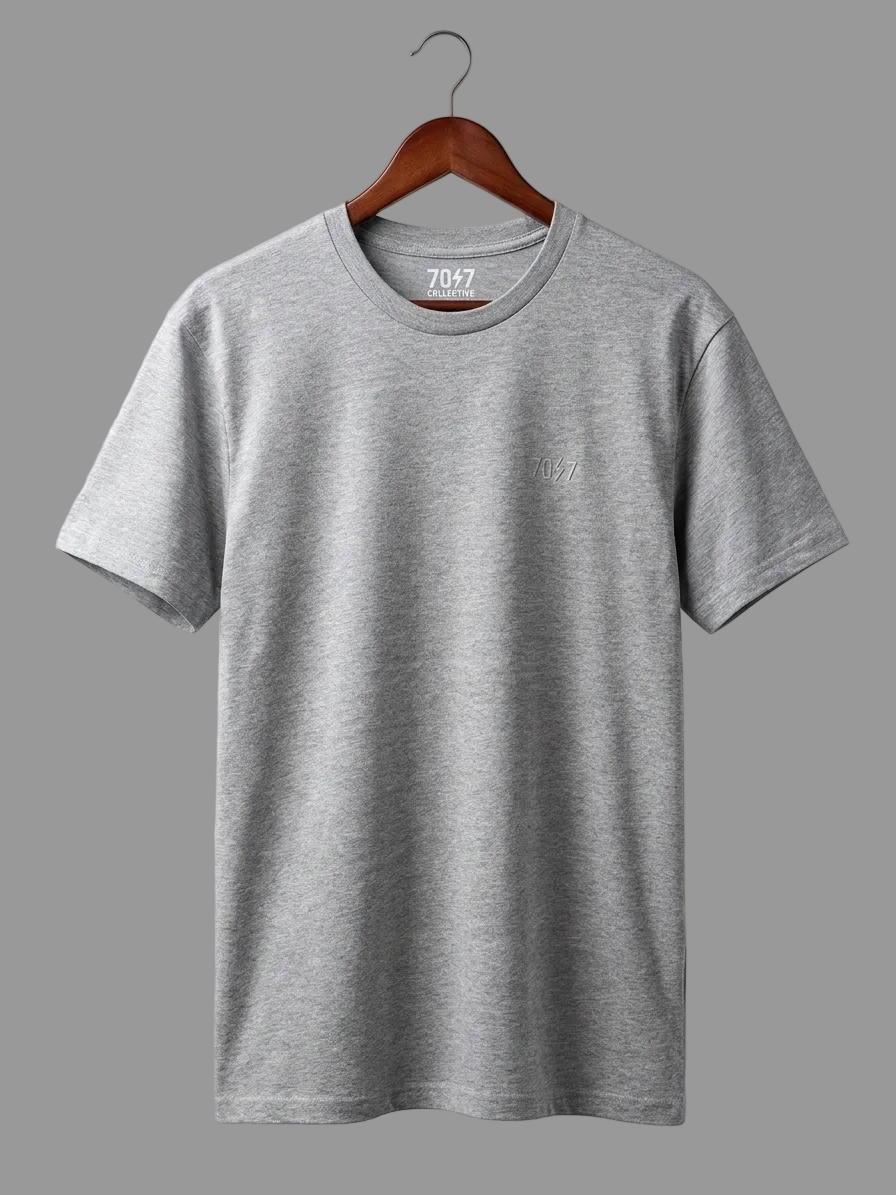 Gray t-shirt on a hanger against a light gray background